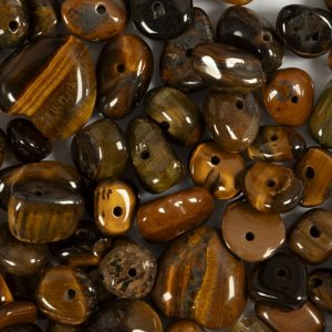 Perles de cristal ?il de tigre brun 7-12 mm - 63 pièces. Perles de cristal ?il de tigre brun 7-12 mm - 63 pièces.
